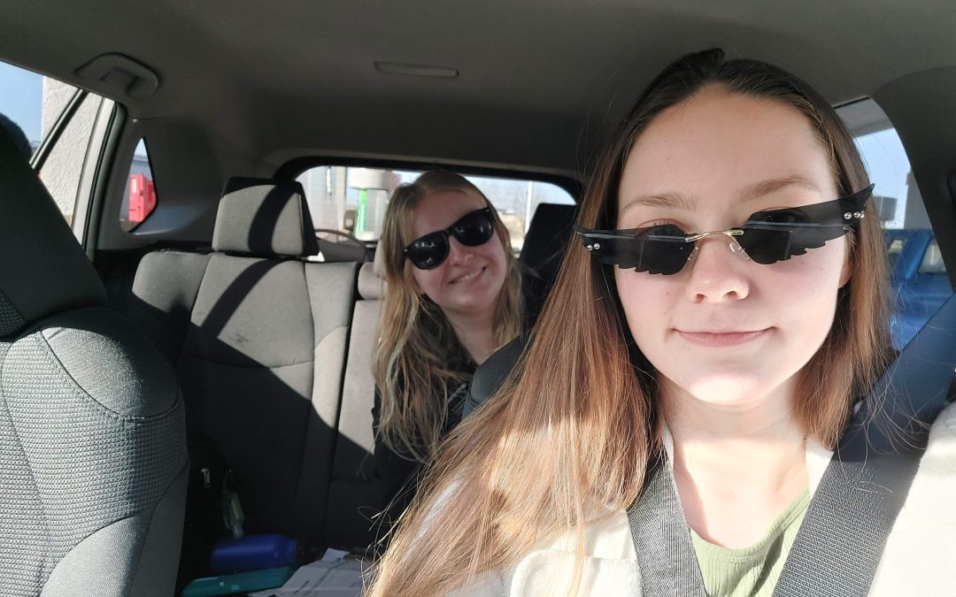 Sadie and another missionary wearing cool sunglasses